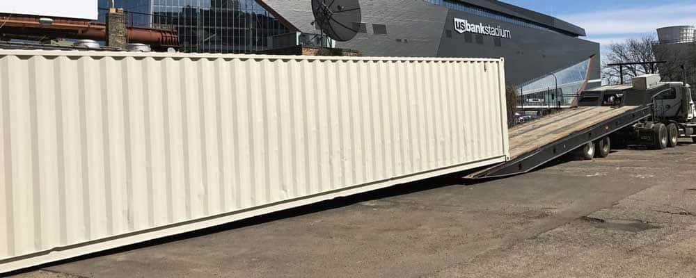 40ft storage container rental being delivered, 40ft shipping container rental delivery truck, 40ft storage containers for rent