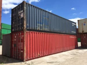 red and blue 40ft shipping containers stacked for sale at intermodal depot, used 40ft shipping containers for sale, 40ft conex containers for sale, buy shipping containers
